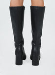 Knee high boots Faux leather material Zip fastening at side Rounded toe Padded footbed Block heel