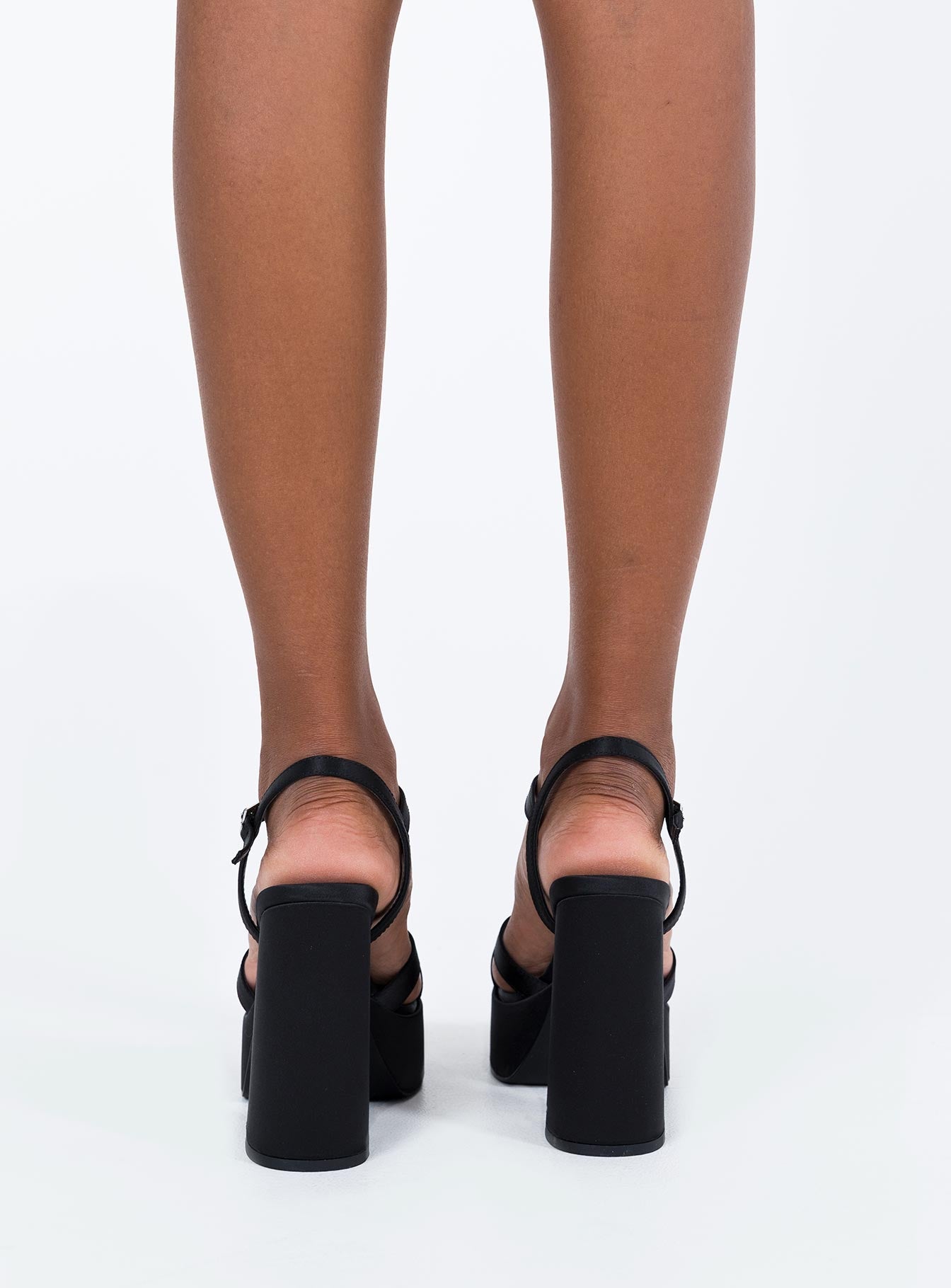 Platform heels Strappy upper Platform base Buckle fastening at ankle Rounded toe Block heel