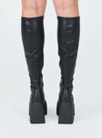 Boots  Faux leather material  Fitted at leg  Block heel Platform base  Square toe  Good stretch 