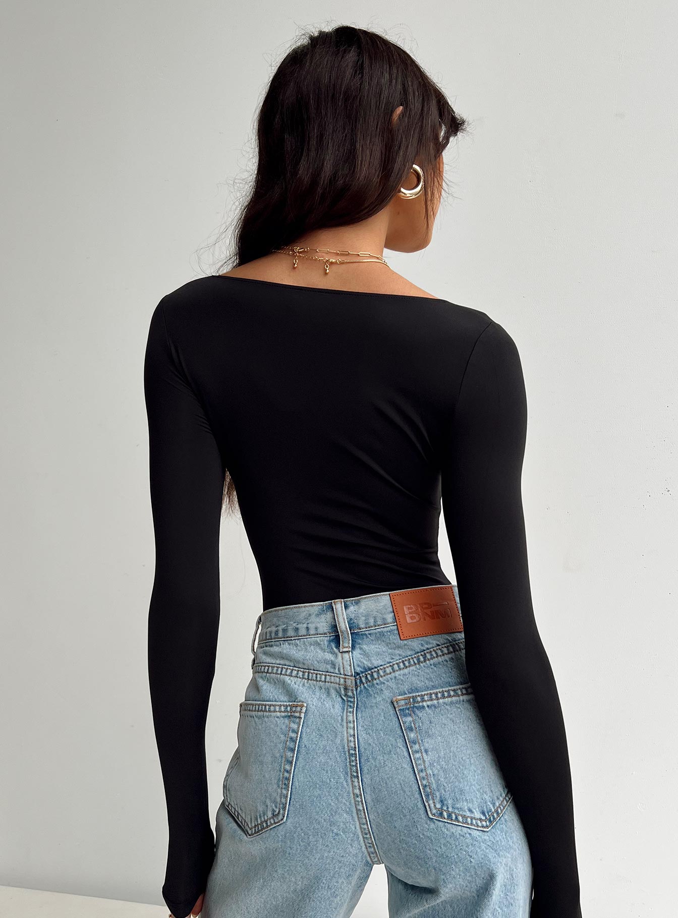 back view of model wearing Princess Polly Malllard Bodysuit Black Full Sleeves Scoop Neck 