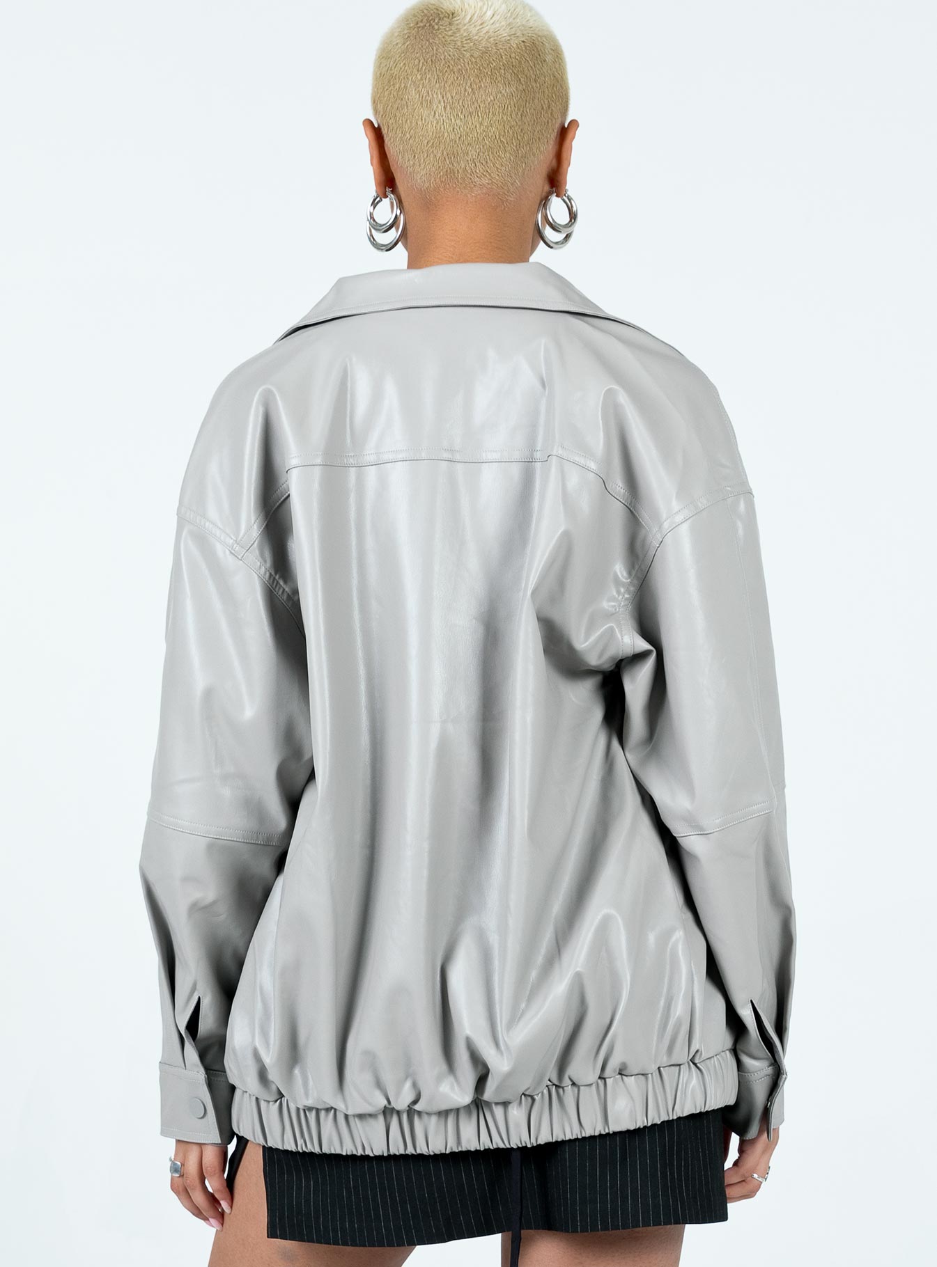 Grey bomber jacket Faux leather material Pointed collar Zip front fastening Twin hip pockets Elasticated waistband