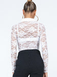 Long sleeve top Sheer lace material  Delicate material - wear with care Classic collar  Button front fastening 