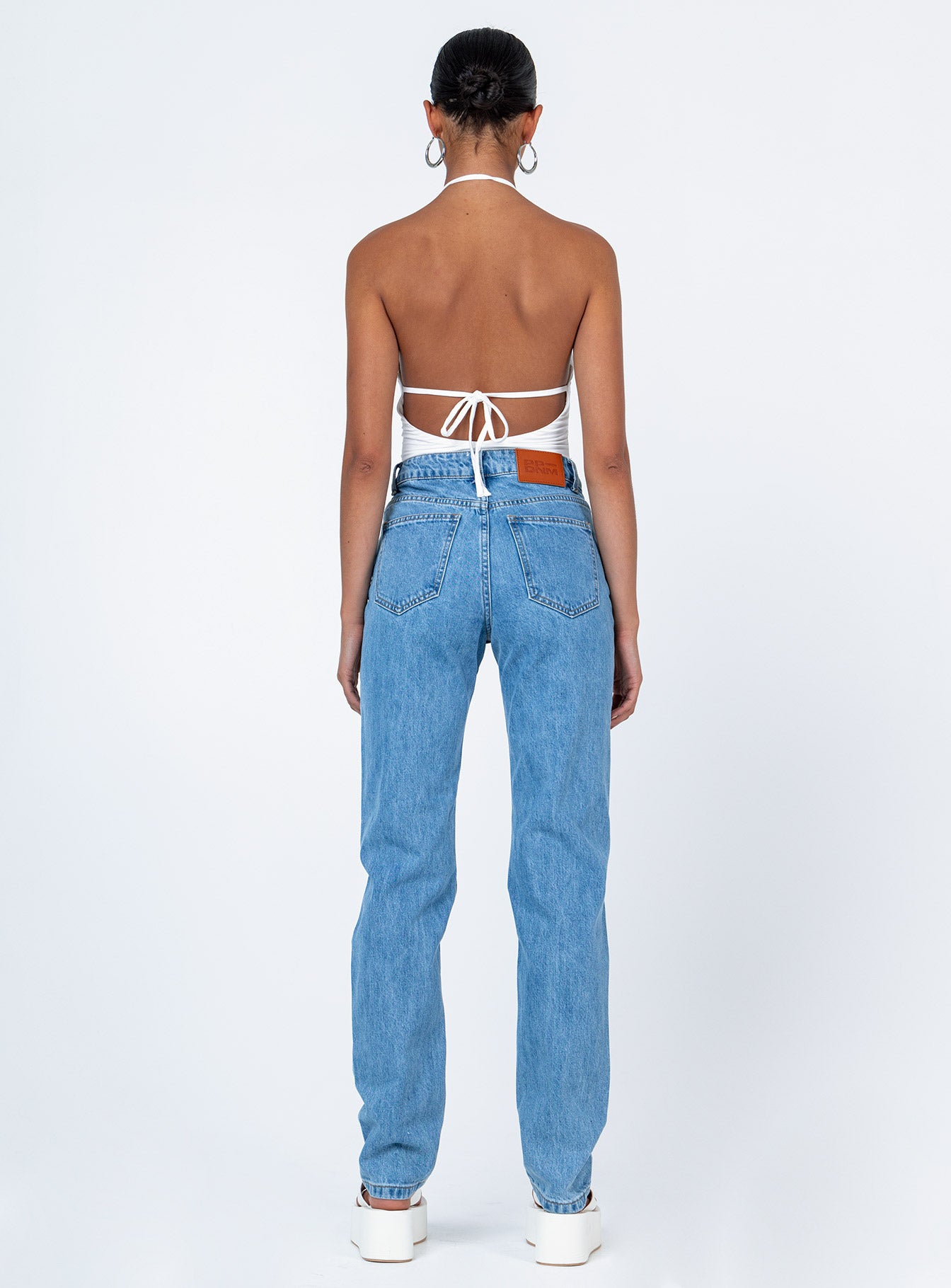 back view of model wearing Princess Polly Demmi Skinny Denim Jeans High Waisted 