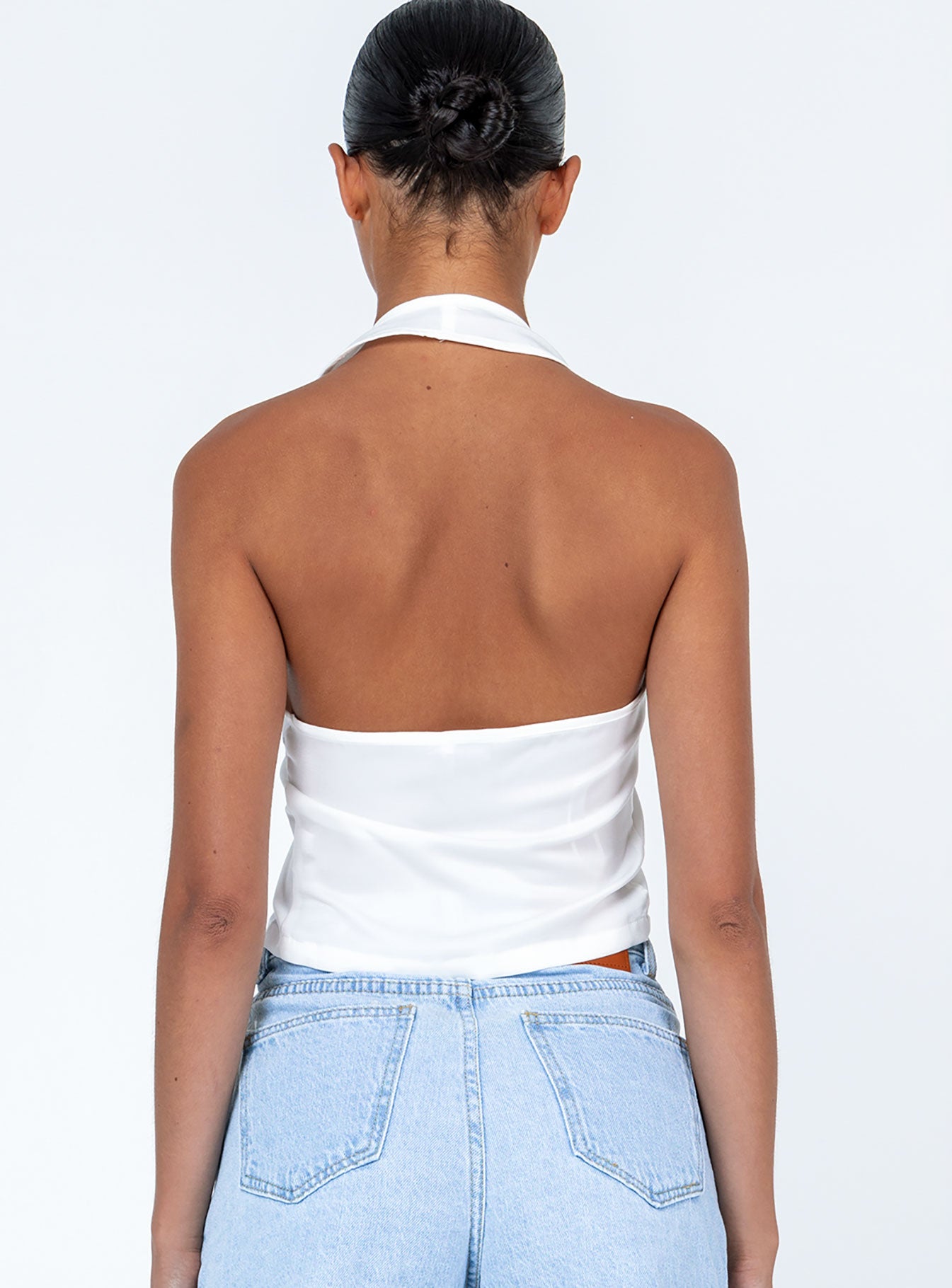 back view of model wearing Princess Polly Gilroy Top White Sleeveless Plunger 