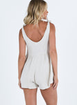 Romper Tie shoulders Wide neckline Twin hip pockets Invisible zip fastening at side Relaxed fitting