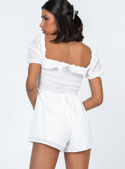 White romper Sheer design  Floral stitched material  Elasticated shoulders Puff sleeves Frill neckline  Shirred bust Fixed tie at waist 