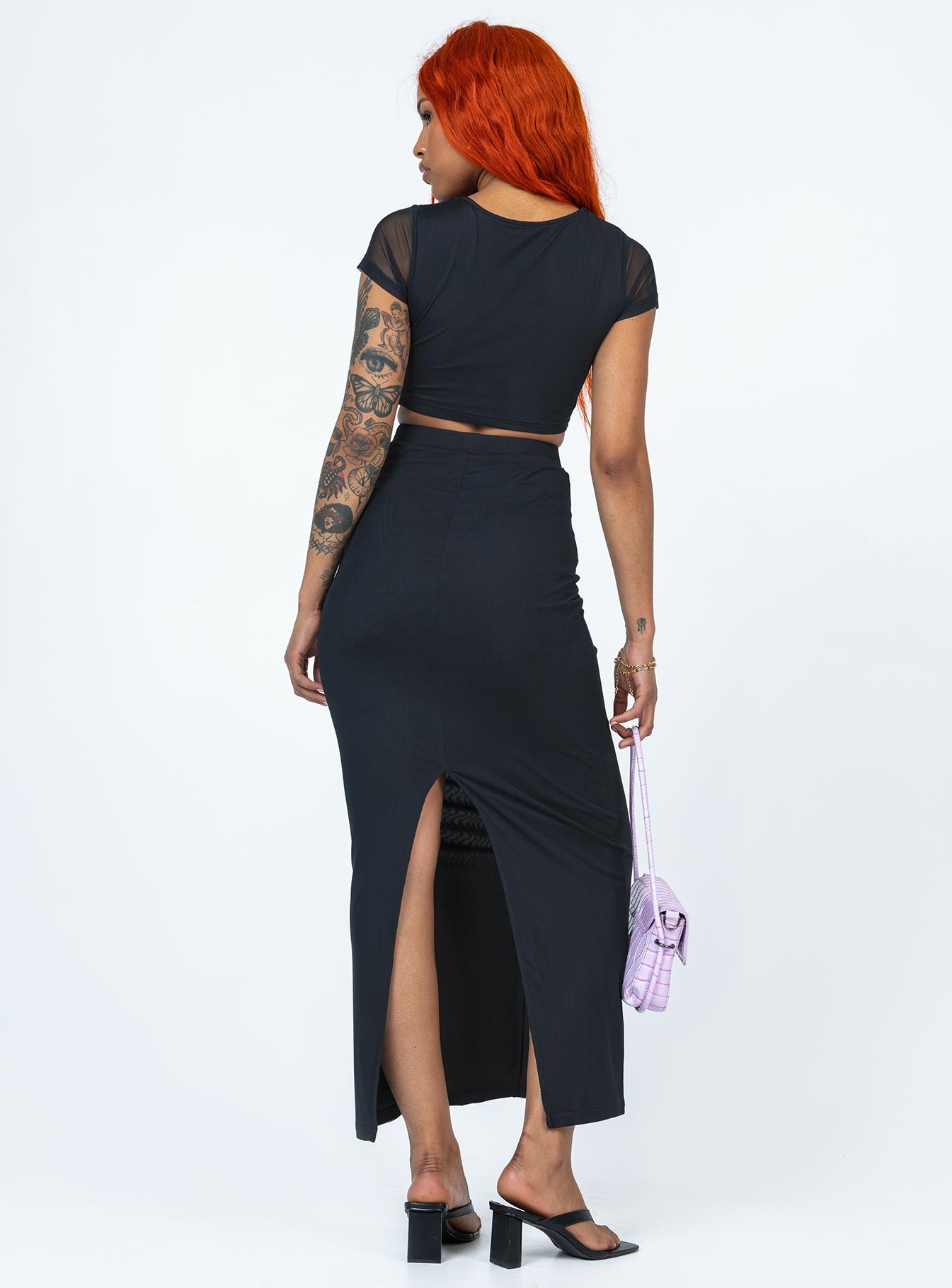 Matching set Mesh material  Ruched front  Cropped tee  High waisted skirt  High back slit 