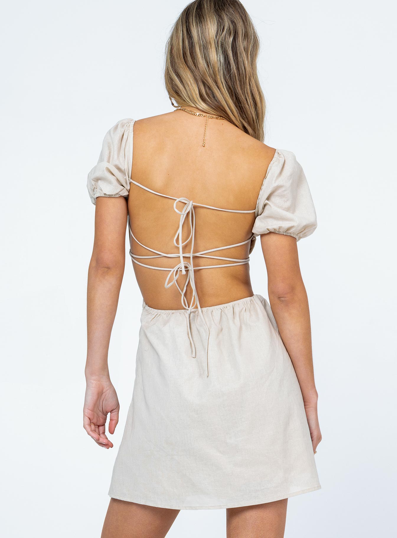 back view of model wearing Princess Polly St. Louis Mini Dress Beige 