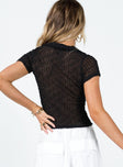 back view of model wearing Princess Polly Westin Top Black Short Sleeves Plunger 