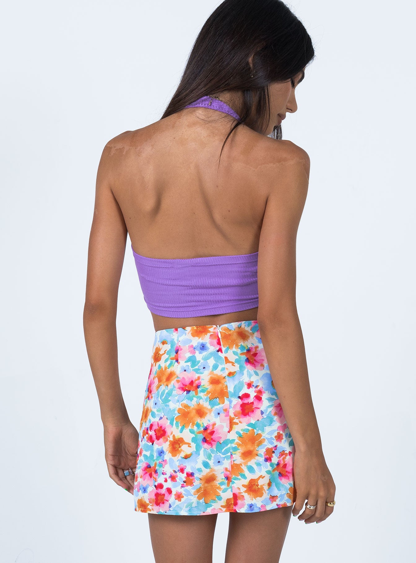 back view of model wearing Princess Polly Selby Mini Skirt Light Blue Floral 