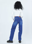 back view of model wearing Princess Polly Dinant Cross Over Denim Jeans Mid Rise 