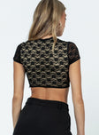 Crop top Lace material High neck with button fastening Boning through front Invisible zip fastening at side