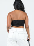 Strapless top Pointed neckline Ruched sides Zip fastening at back Boning through front Layered hem
