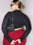 Black long sleeve crop top Ribbed material Cut out circle Button fastening at neck High neckline Slim fitting