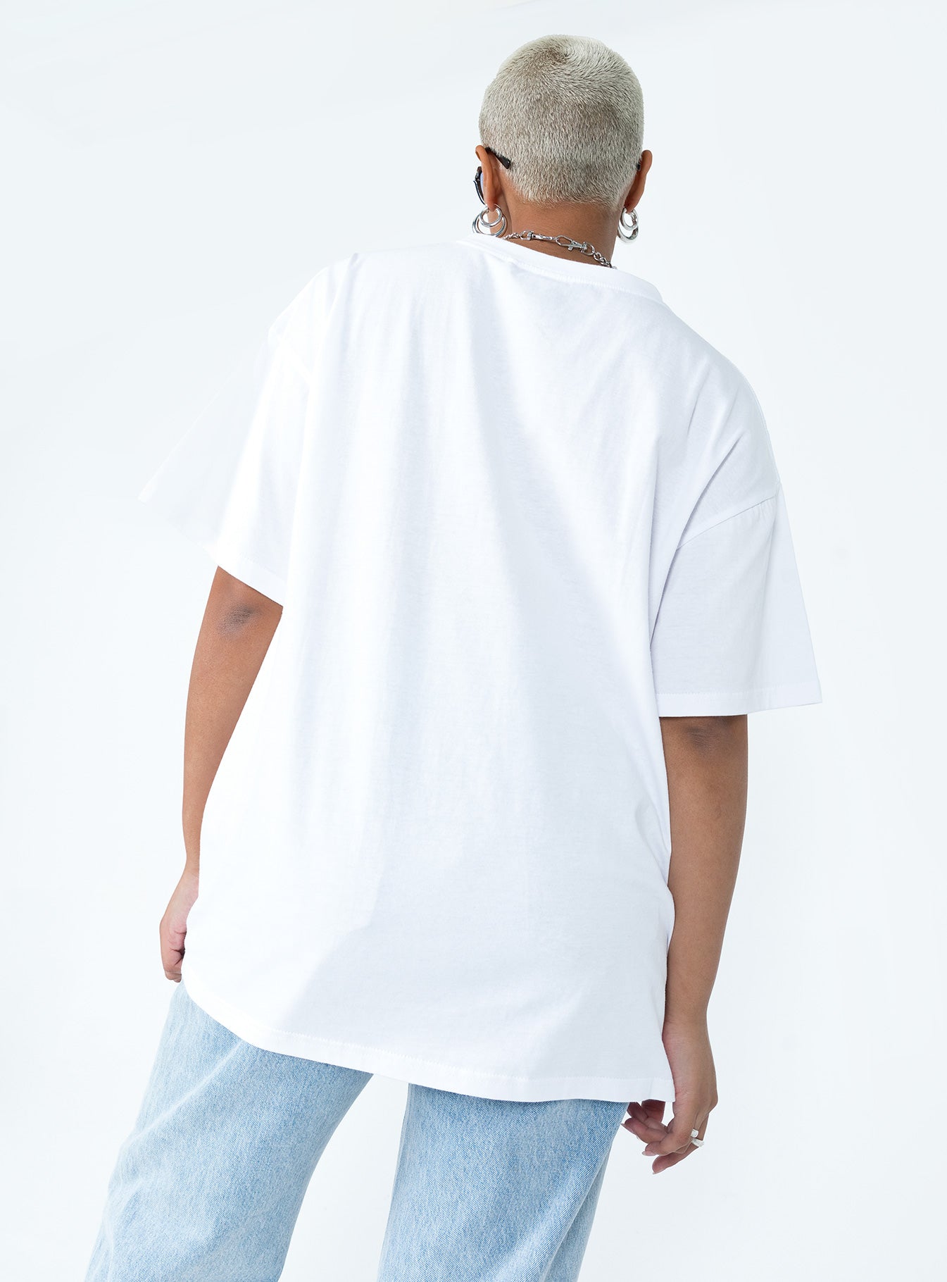 back view of model wearing Princess Polly Tweety Post Card Vacation Oversized Tee White Short Sleeve Crew Neck 