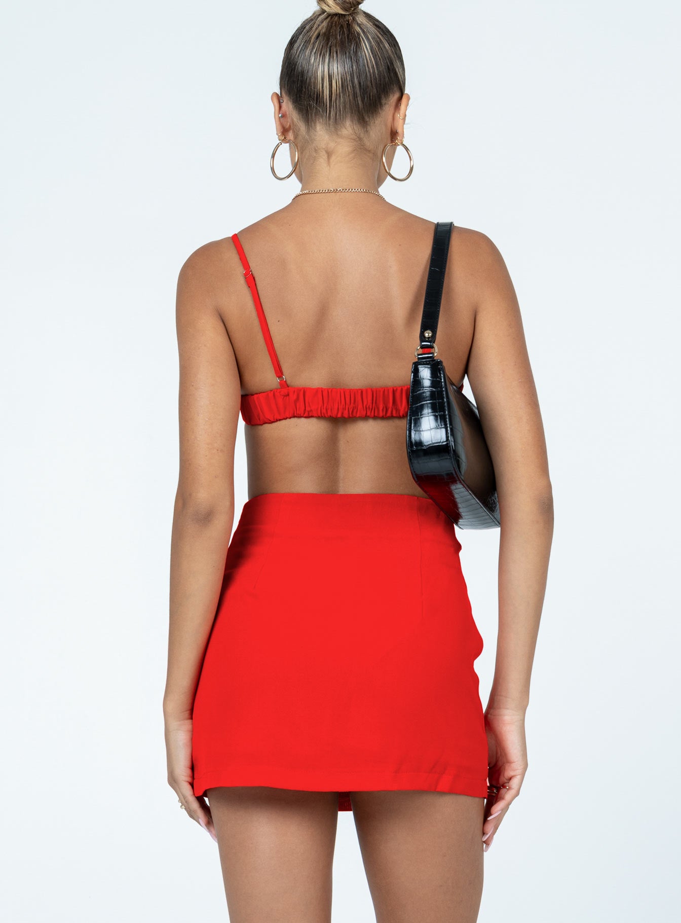 Matching set  100% polyester Bra top  Adjustable shoulder straps  Padded bust  Wired cups  Elasticated back  High waisted mini skirt  Invisible zip fastening at side 