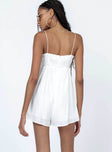 Romper Silky material  Lace trimming  Elasticated shoulders Tie at bust  Shirred back  Invisible zip fastening at back 