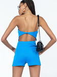 Strapless romper Ribbed material  Inner silicone strip at bust  Button fastening at back  Low back