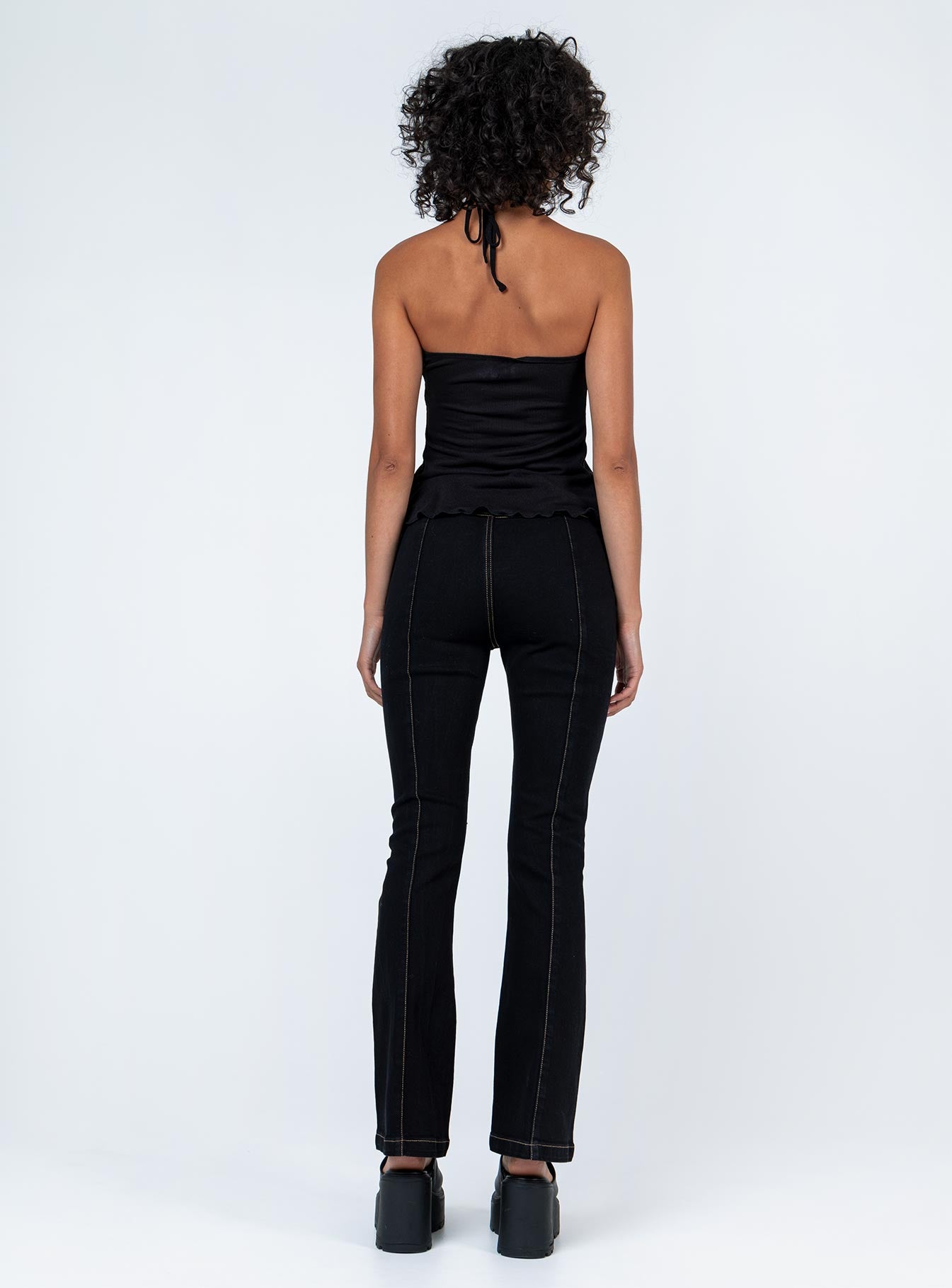 back view of model wearing Princess Polly Zia Flare Pants Black 