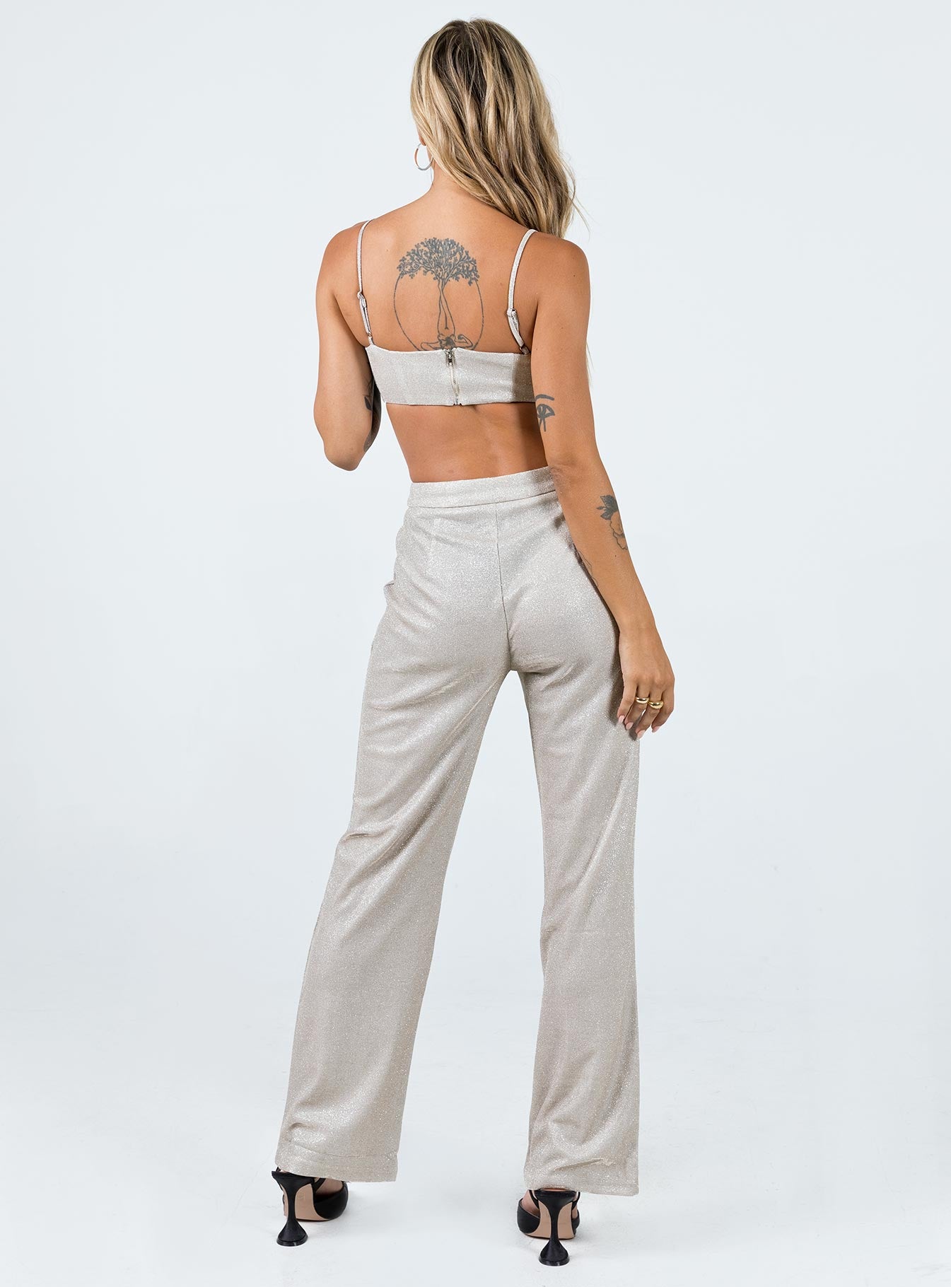 Matching set Sparkly material Crop top Adjustable shoulder straps Zip fastening at back Pants High rise Zip & clasp fastening  Subtle pleats at waist Straight leg