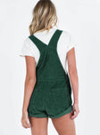 Khaki overalls Cord material  Adjustable shoulder straps  Button fastening at hips  Chest pocket 