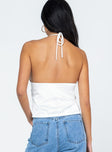 Crop top Silky material Halter neck tie fastening Elasticated back Single-button fastening at bust