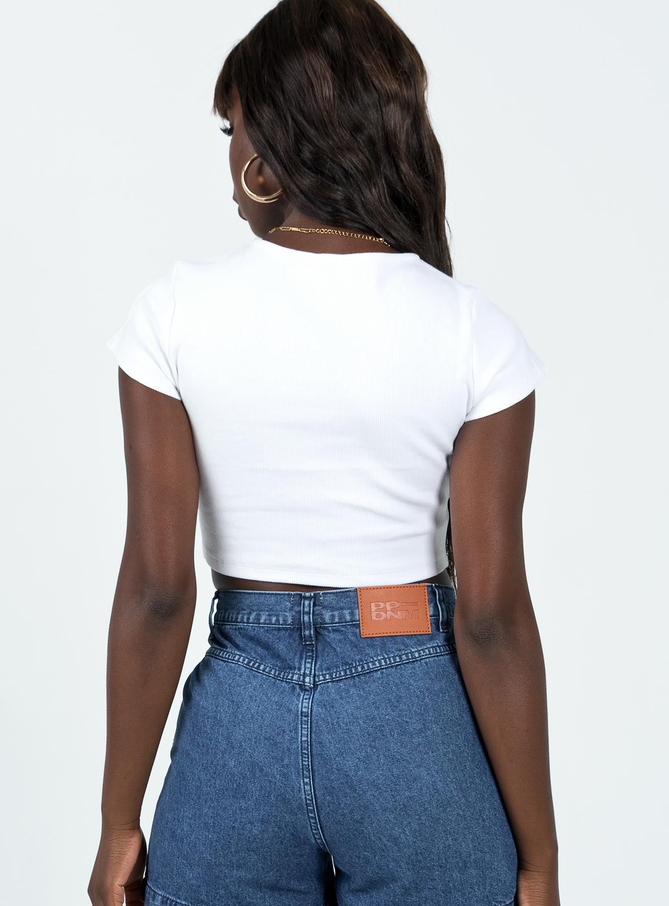 Front view of model wearing  front Princess Polly Short Sleeves Square Neck  Classic Crop Tee White