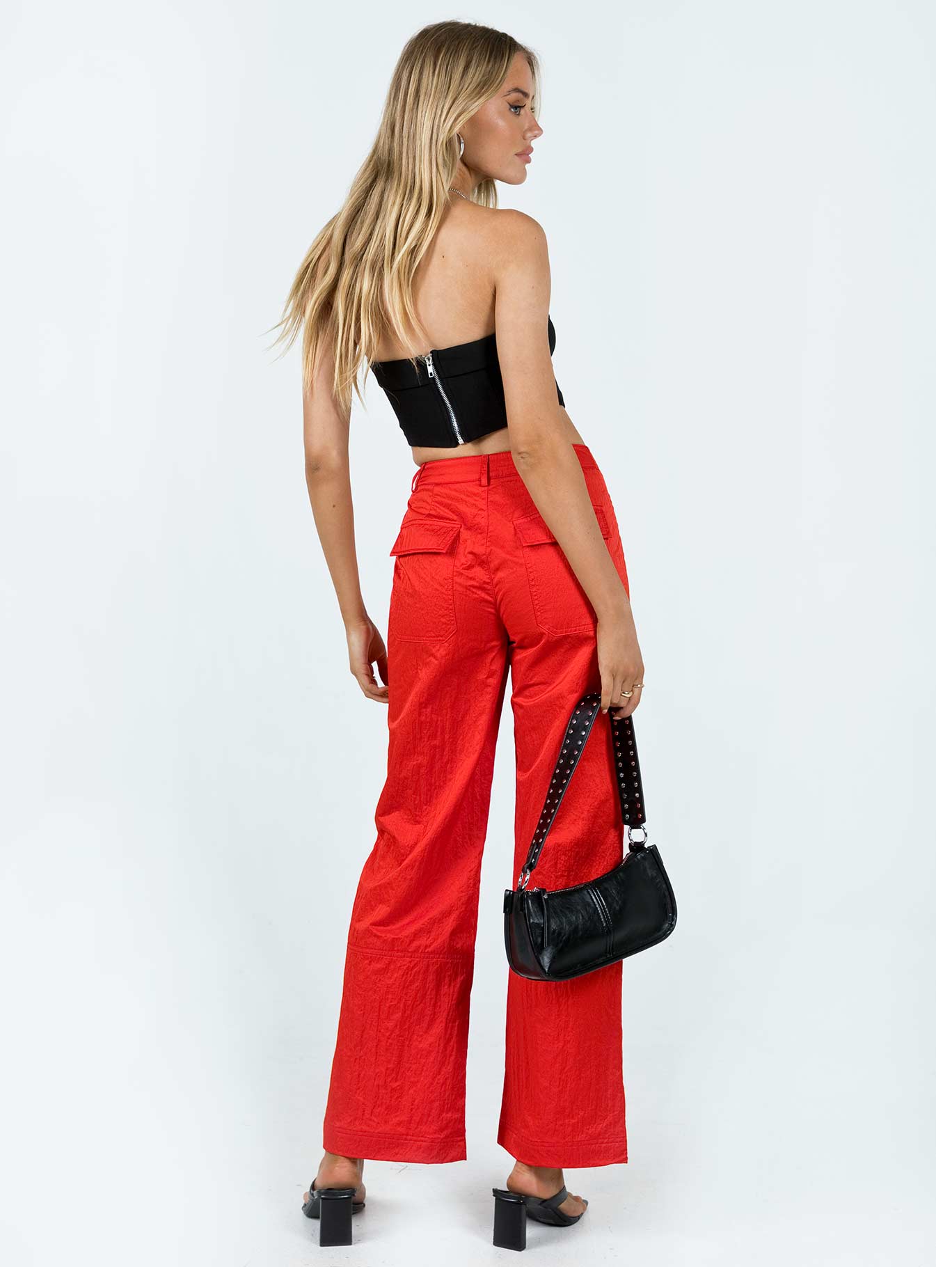 Front view of model wearing  front Princess Polly  Pagden Nylon Cargo Pants Red