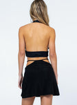 Low waist mini skirt  Slim fitting 50% nylon 45% metallic 5% elastane  Shimmer material  Semi detached waistband 