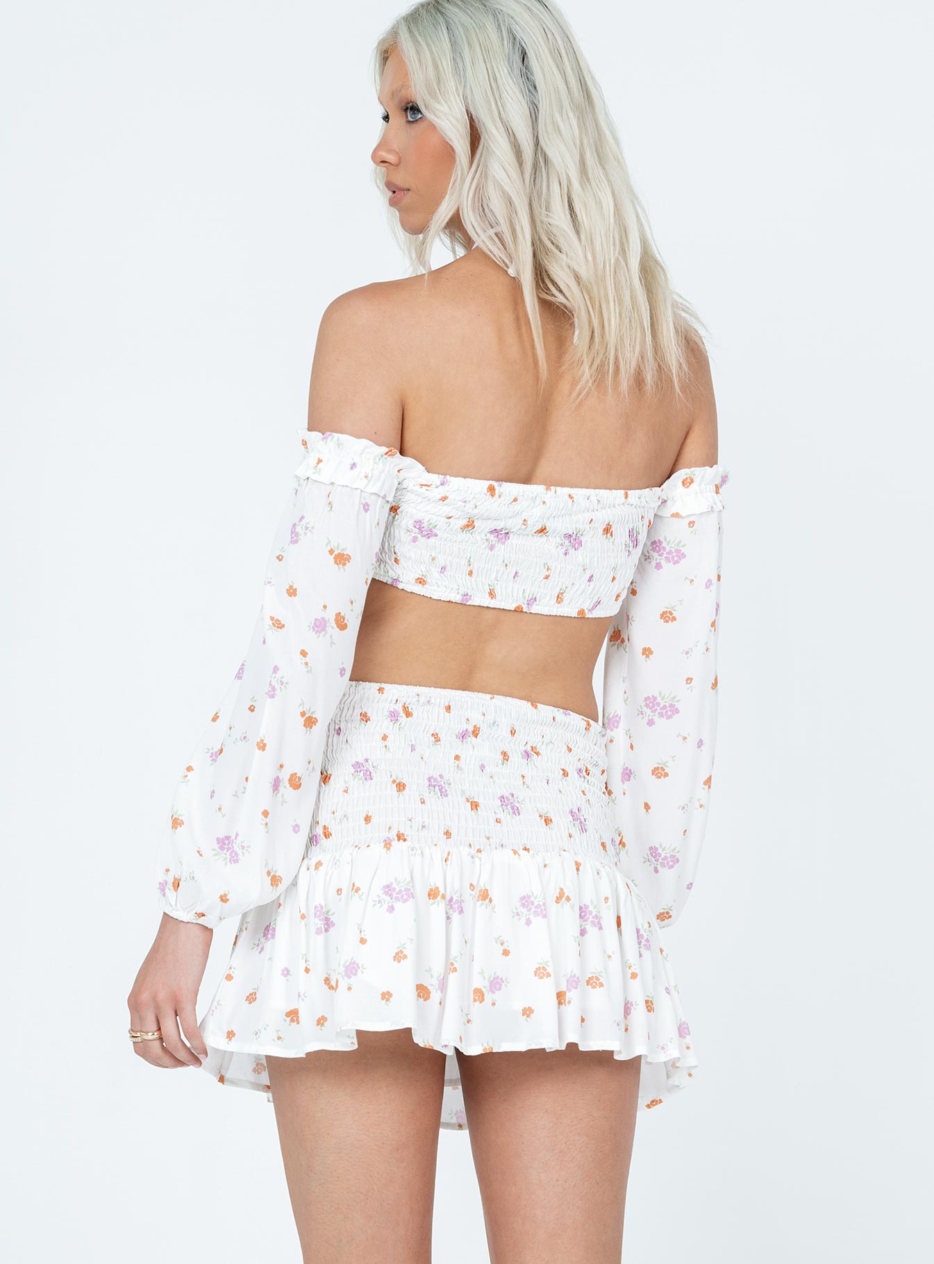 Matching set Floral print  Long sleeve crop top  Ruffles throughout  Tie fastening at bust  Shirred back  Mini skirt  Shirred waist  Frill hem 