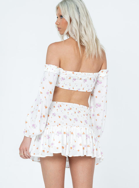 Matching set Floral print  Long sleeve crop top  Ruffles throughout  Tie fastening at bust  Shirred back  Mini skirt  Shirred waist  Frill hem 