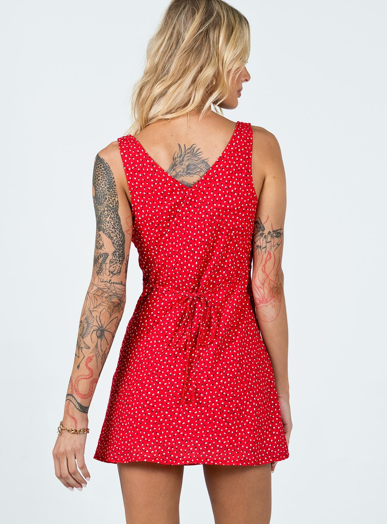back view of model wearing Princess Polly Nellie Mini Dress Red Floral V-Neck 