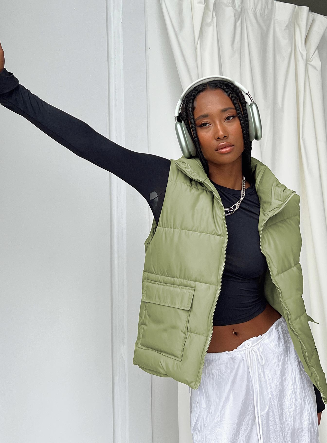 Puffer vest High neck Zip front fastening Twin hip pockets Non-stretch