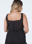 back view of model wearing Princess Polly Normani Top Black Sleeveless Square Neck 