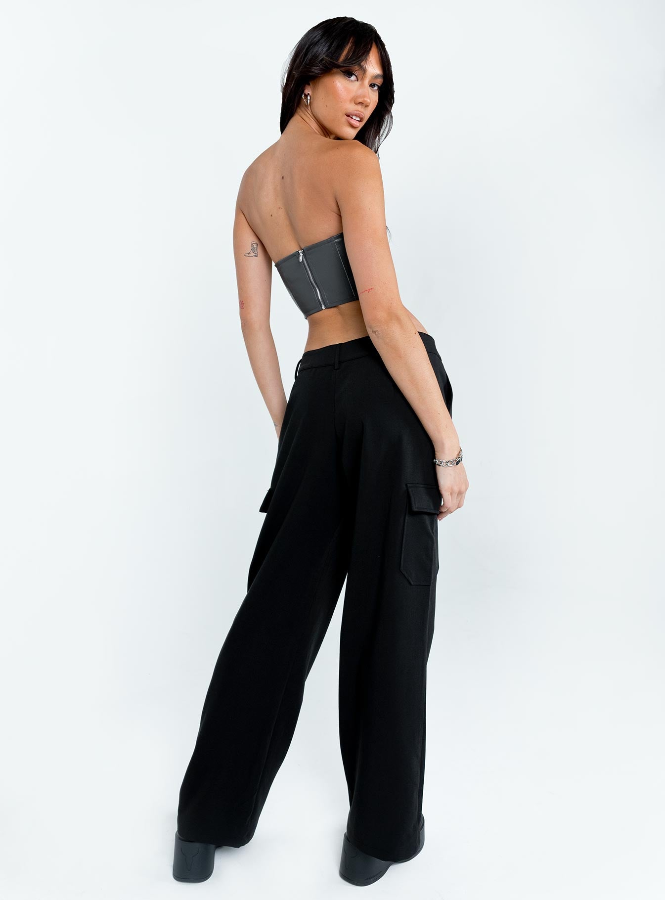 back view of model wearing Princess Polly Motel Low Rise Abba Cargo Black 