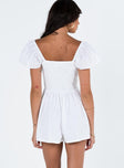 White romper Elasticated shoulders & neckline  Tie at bust  Shirred waist  Twin hip pockets  Fully lined 