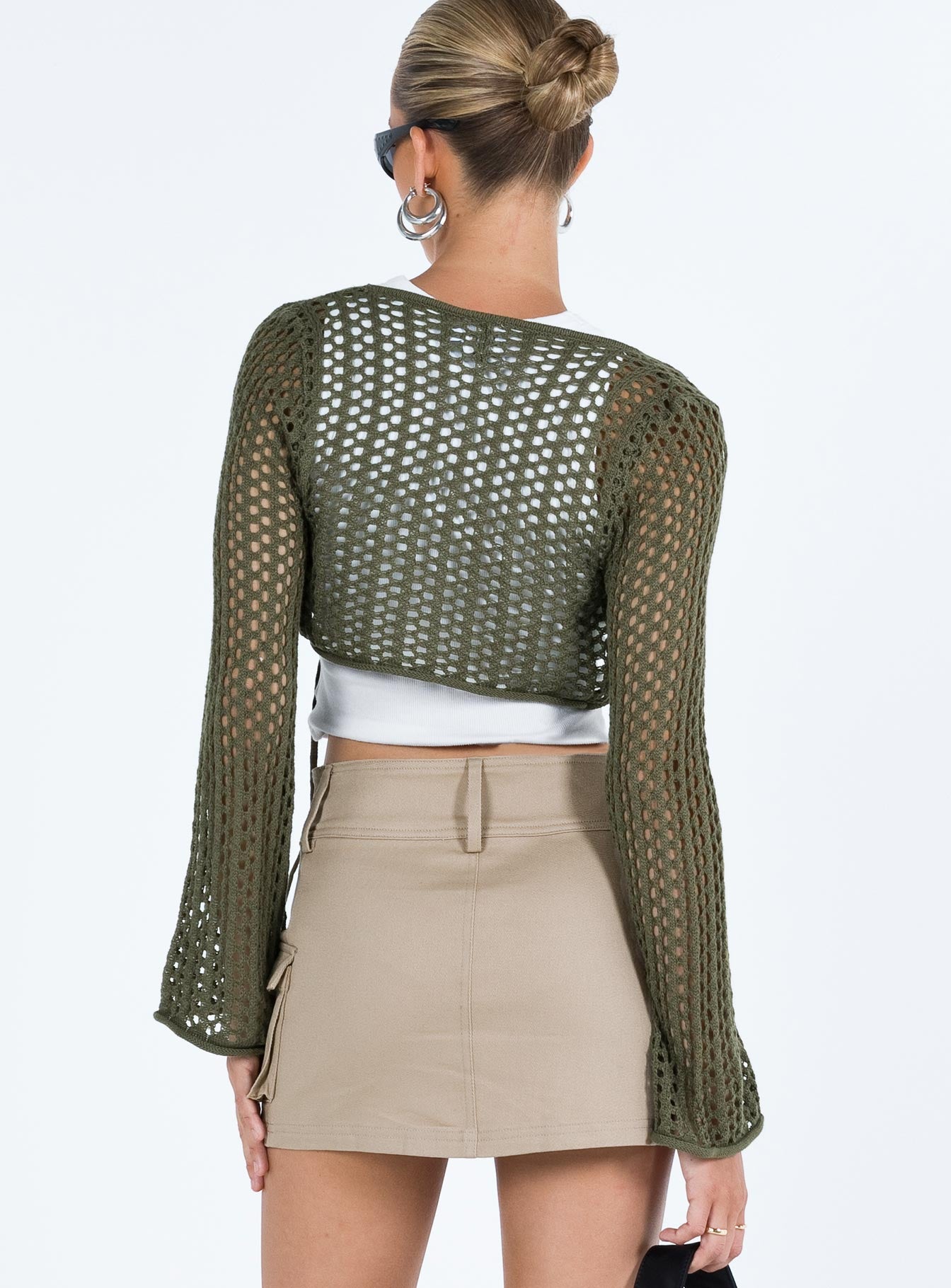 back view of model wearing Princess Polly Savi Long Sleeve Cardigan Green Cropped 
