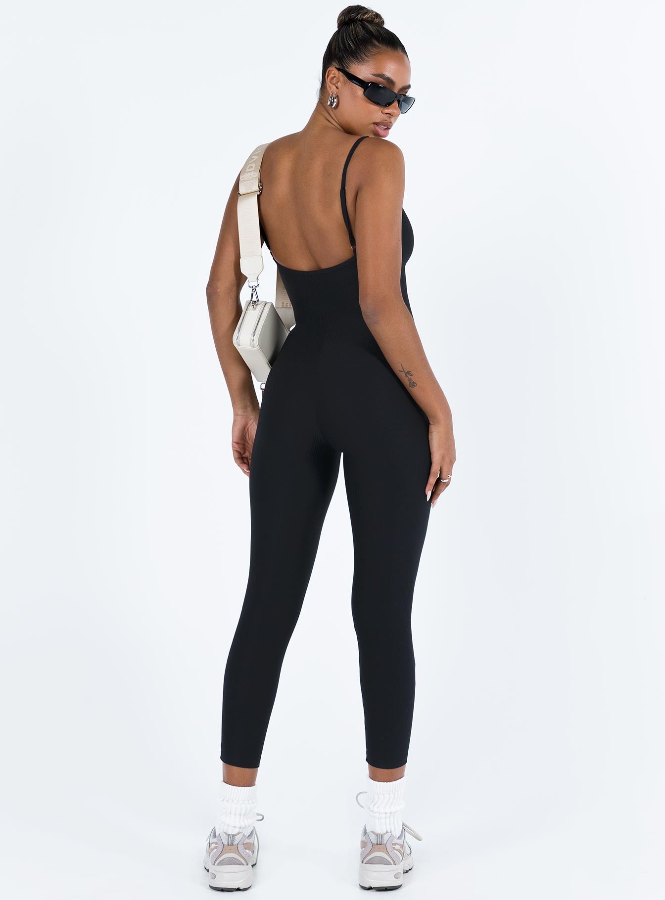 Black jumpsuit Ribbed material Scooped neckline Adjustable shoulder straps Good stretch Unlined 