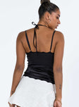 Black top Satin and lace material Adjustable shoulder straps V neckline Button front fastening Curved hem