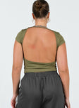 Front view of model wearing  front Princess Polly Short Sleeves Square Neck  Solita Top Green