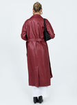 Long coat Faux leather material Lapel collar Removable waist tie Belt loops at waist Twin hip pockets Split hem at back