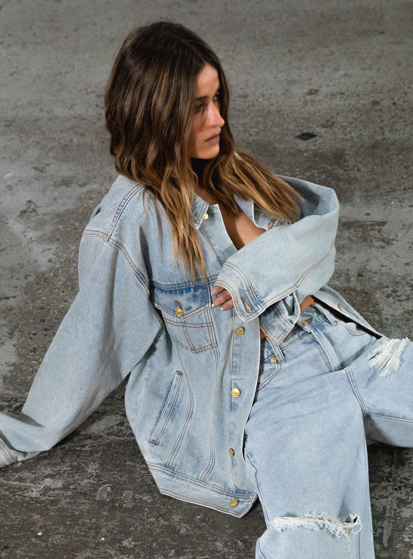 Denim jacket Light wash denim Classic collar Button fastening at front Four pocket design Gold-toned hardware Embroidered graphic at back