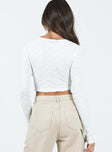 Long sleeve top Crinkle material  V neckline  Double tie front fastening  Cut out midriff 