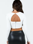Long sleeve top Wide neckline  Panel stitching  Button fastening behind neck  Open back Zip fastening at back 