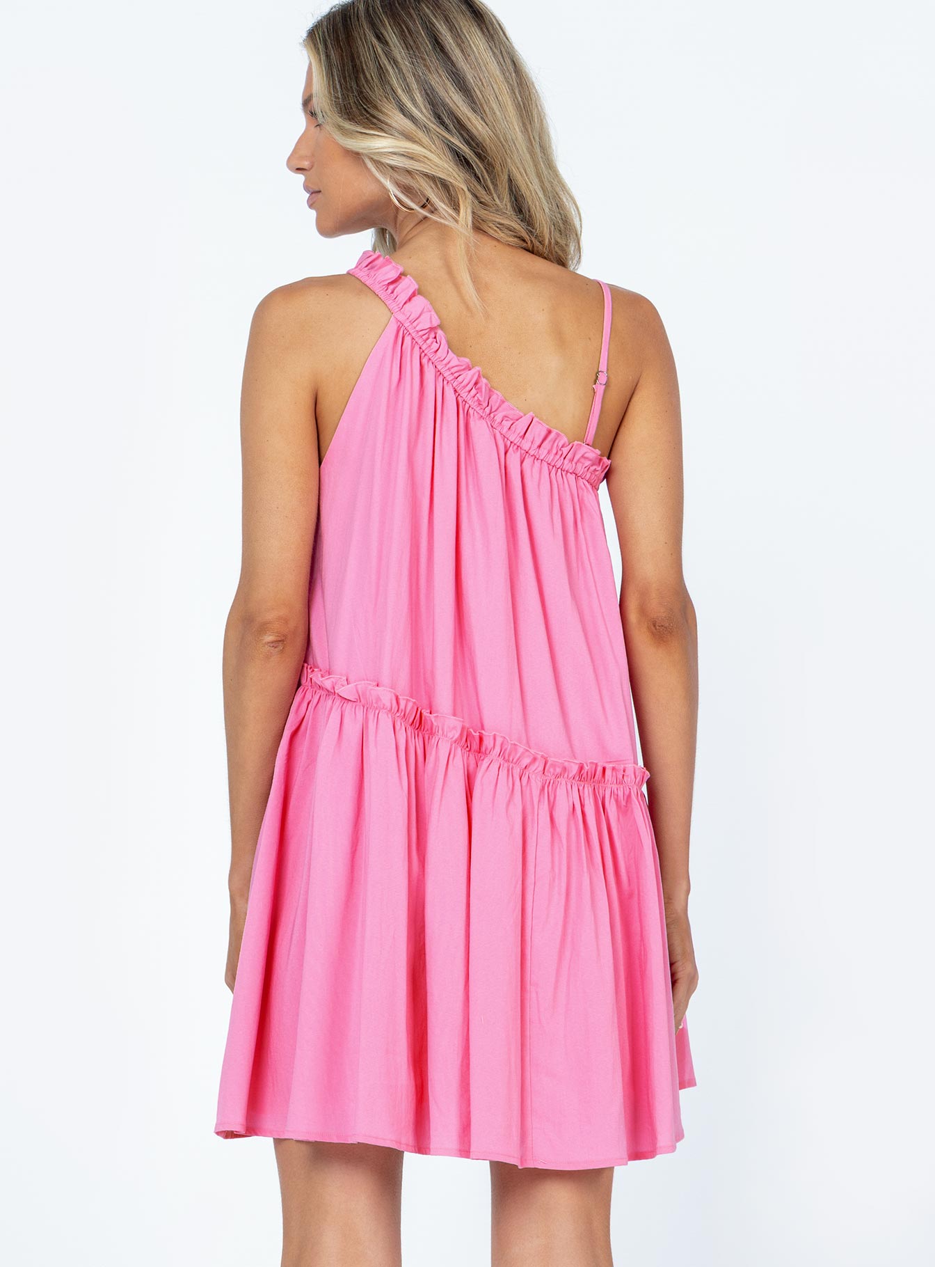 back view of model wearing Princess Polly Subi Mini Dress Pink Asymmetric Neckline 