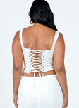White top Sheer perforated material  Sweetheart neckline  Fixed tie at bust  Lace up back fastening 