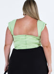 Green corset Silky material Cap sleeves Square neckline Zip fastening at back Boning throughout