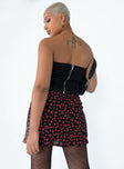 Mini skirt Floral print  High waisted  Invisible zip fastening at back  Side slit  Non-stretch