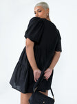 back view of model wearing Princess Polly Braxton Mini Dress Black V-Neck 