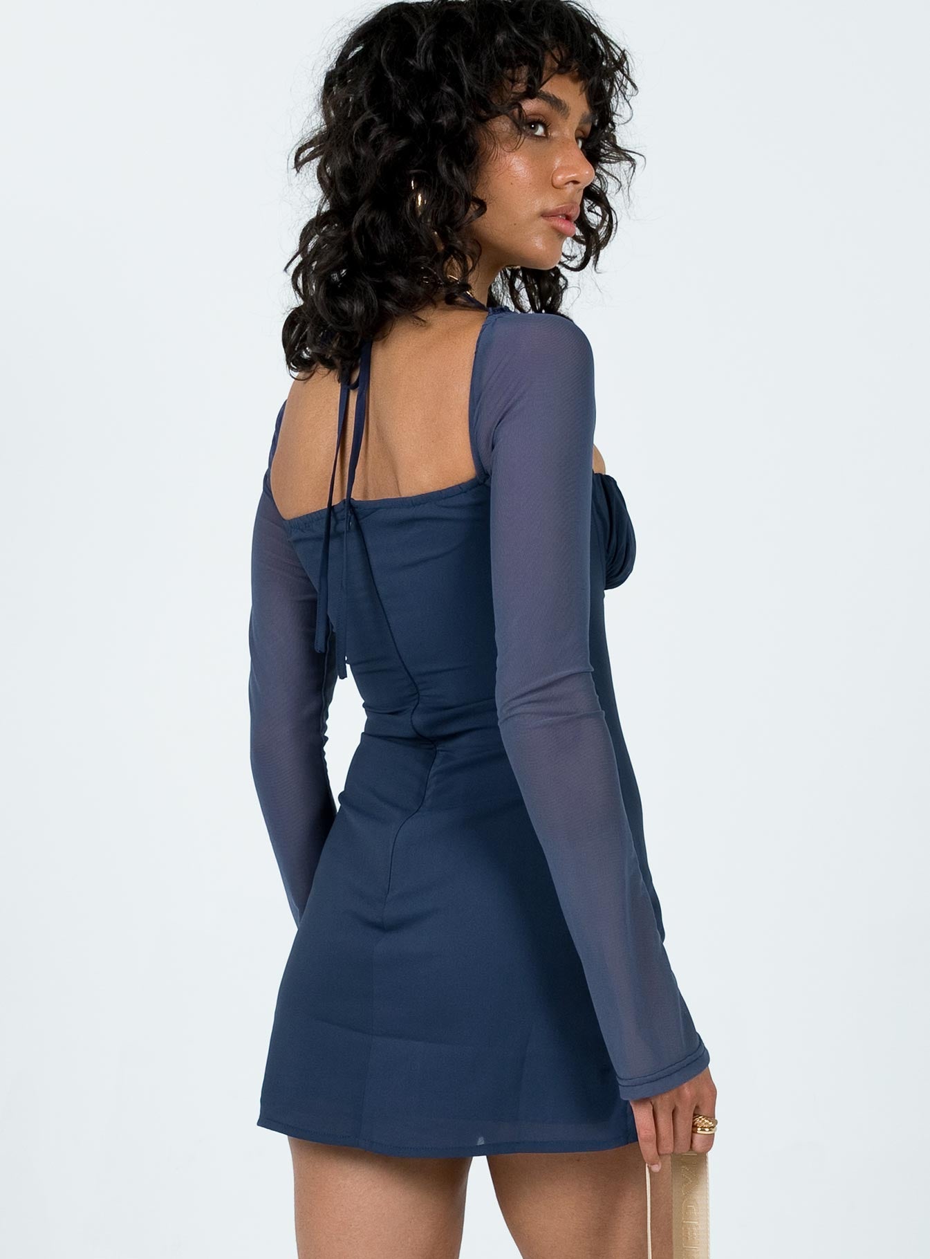 Navy dress shop with sheer sleeves